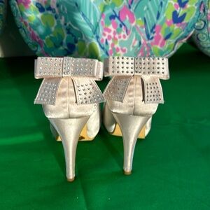 Elegant Park cream satin heels with big back bows and rhinestones